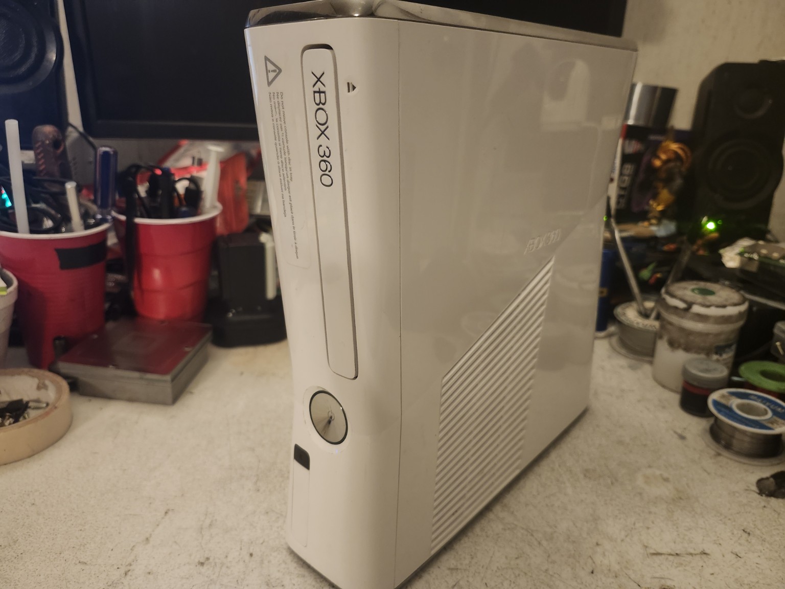 Xbox 360 All-White Edition upright front-left shell view