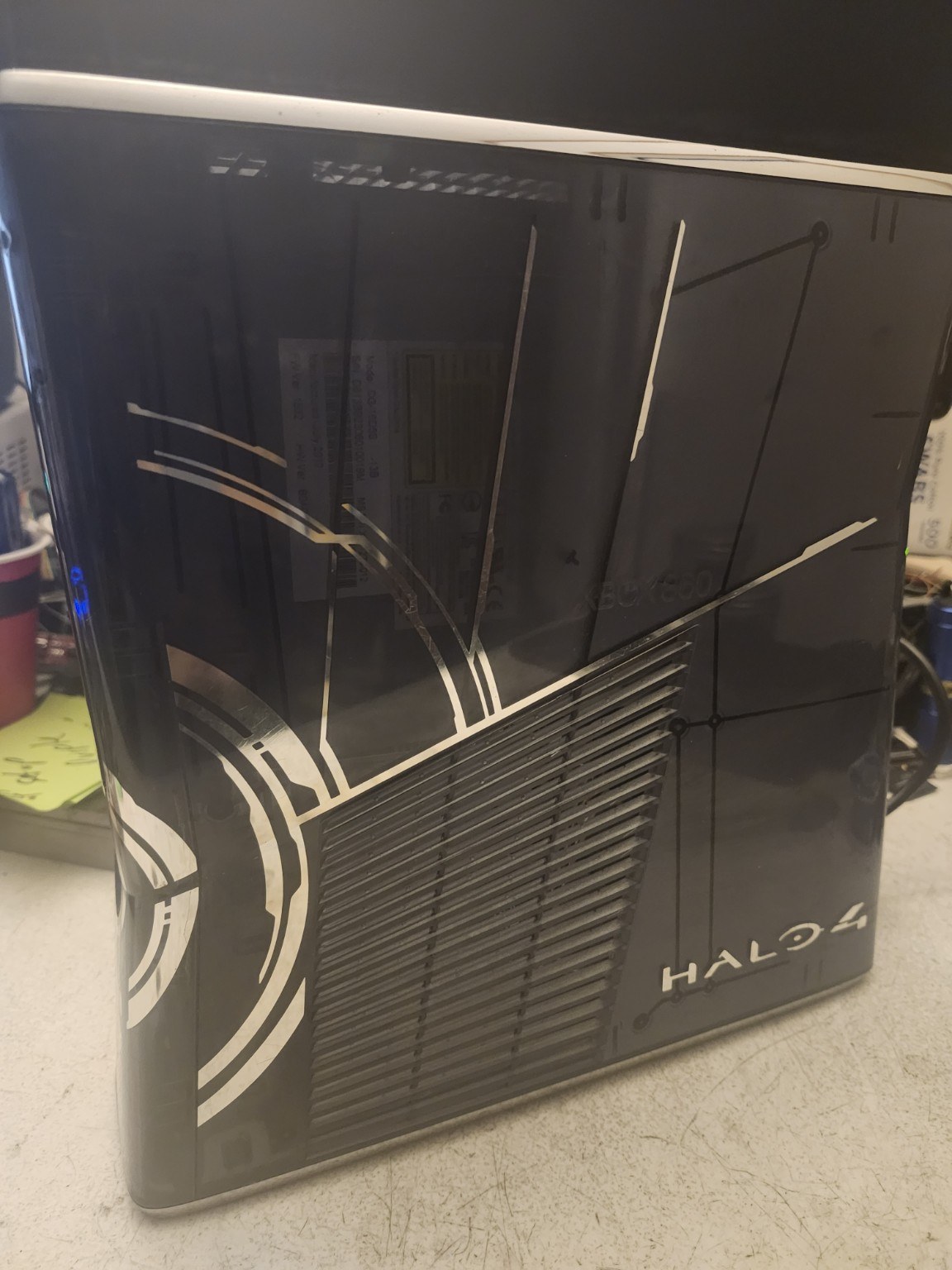 Actual Xbox 360 Halo 4 console upright Halo 4 shell side view