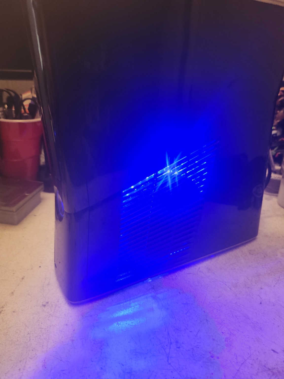 Xbox 360 Slim 1TB blue lighting photo 2