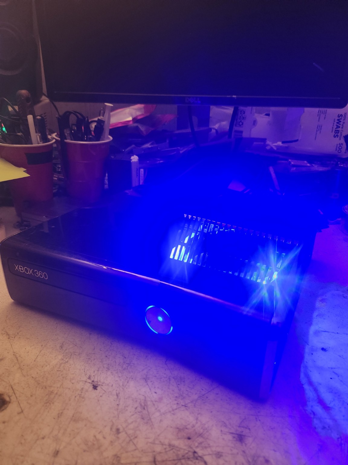 Xbox 360 Slim 1TB blue lighting photo 4